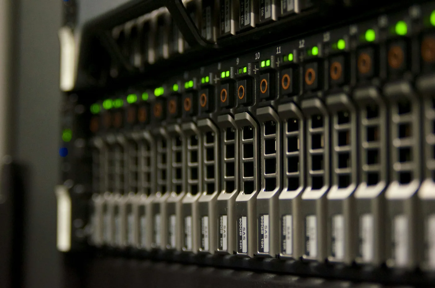 A server rack with rows of drive bays and green status lights